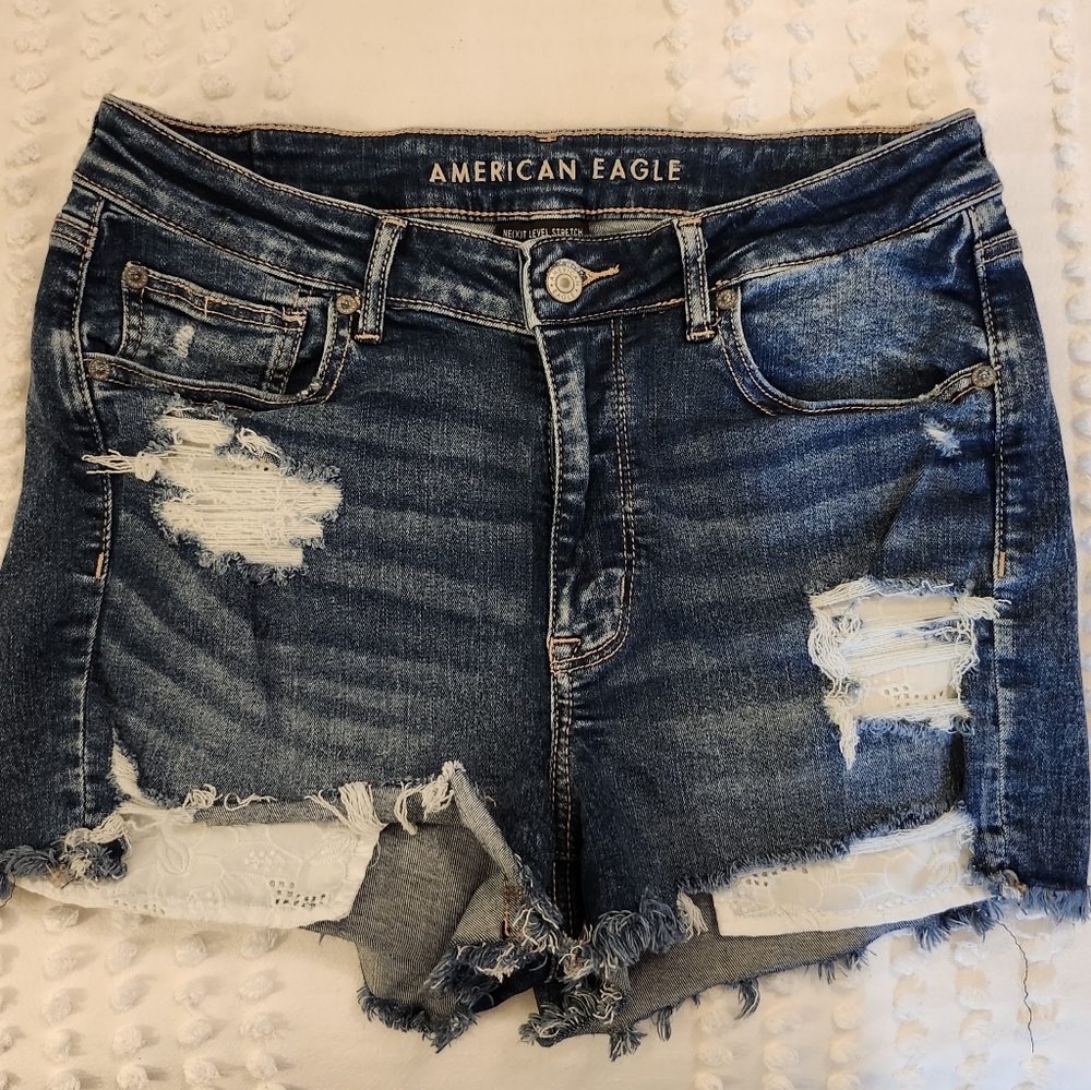 American Eagle High Rise Shorties. Distressed Denim with exposed pockets